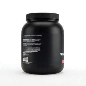 Schwarze Dose des Whey Protein Strawberry von THE VITAL MANUFACTURE, 1000g Inhalt, mit Erdbeer-Grafik und Angabe von 23g Protein pro Portion.
